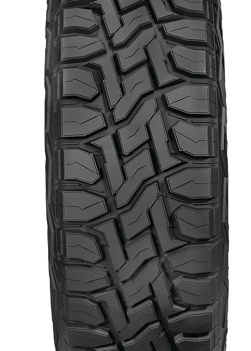 A single black all-terrain tire with a deep, aggressive tread pattern, shown from a front-facing perspective on a solid white background.